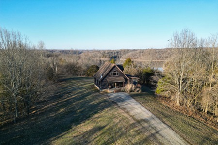 Cottage with 79 Acres Bordering Taylorsville Lake Property!
