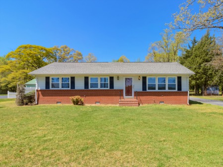 County Seat Highway Home Conveniently Rests Between Laurel and Georgetown and Features a Large Backyard and Two-Car Garage