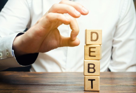 Swimming In Debt? Here's How to Come Up With a Debt Repayment Strategy