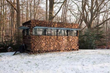 A House From a Pile of Wood