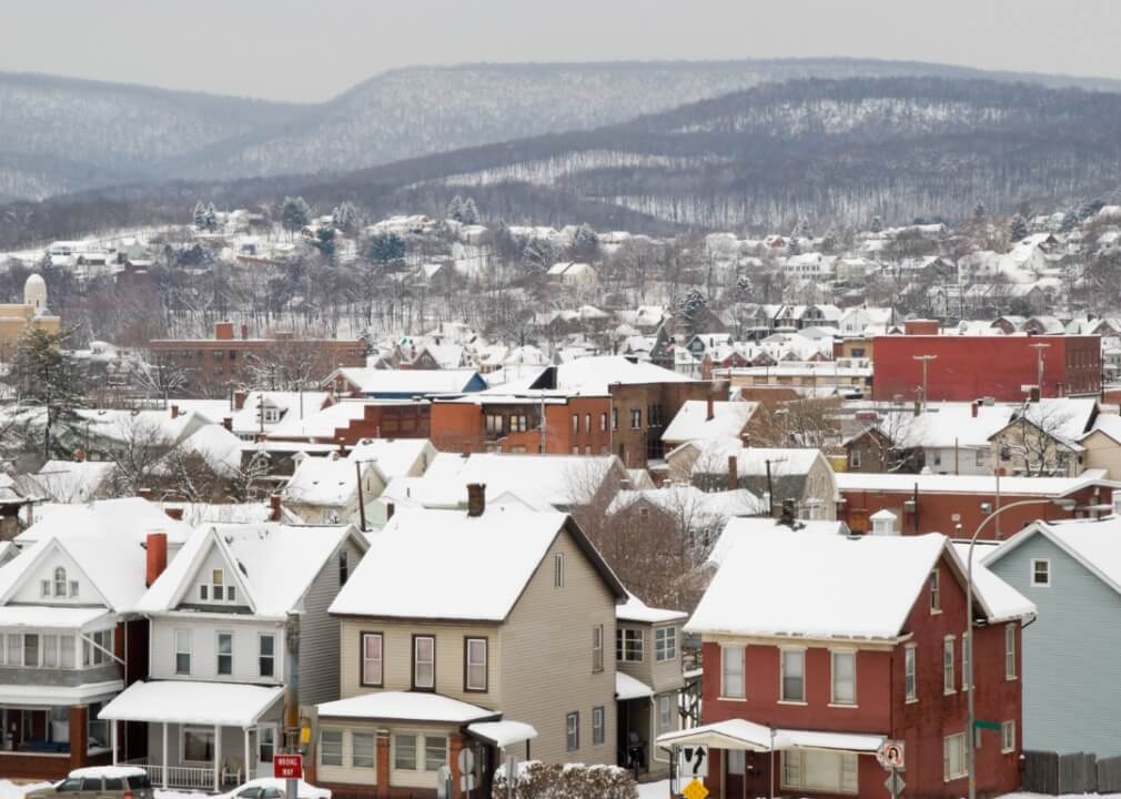 #7. Altoona, Pennsylvania Rooftops covered in snow, surrounded by mountains.