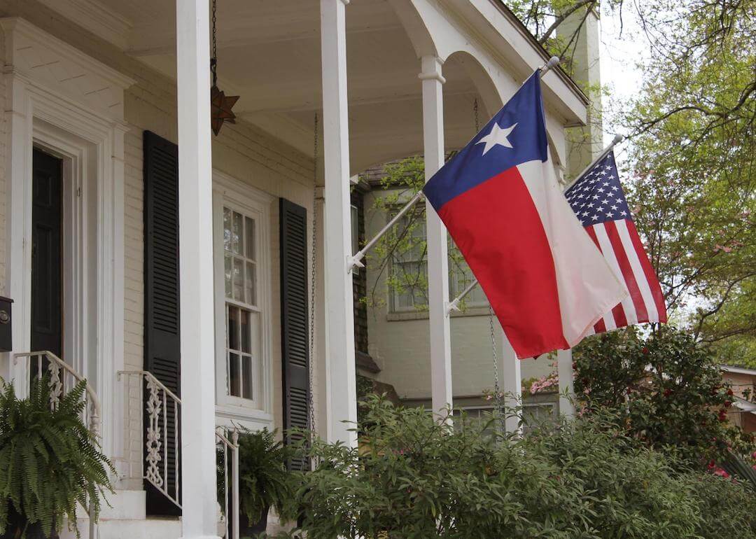 #3. Texas Historic home with Texas and American flags.