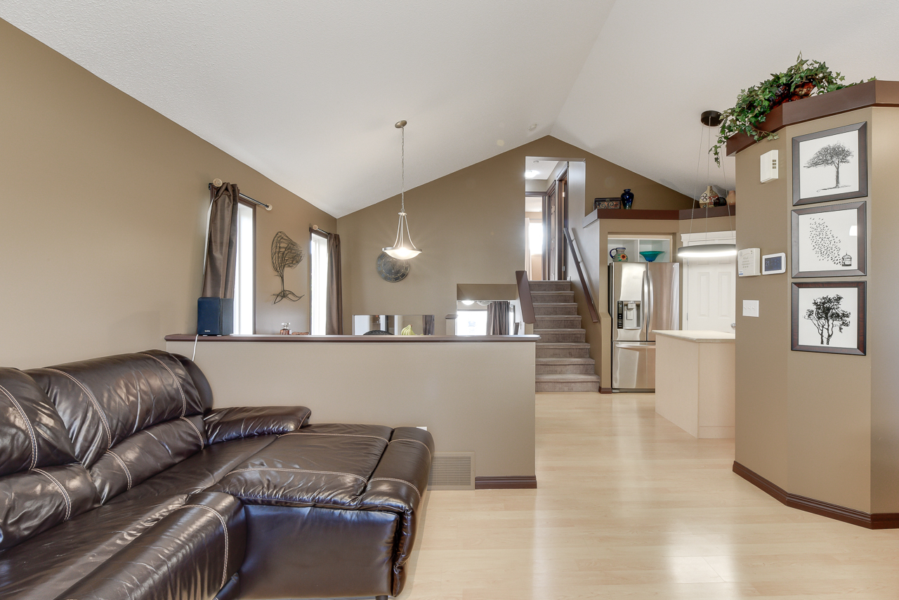 a brown leather couch in a living room