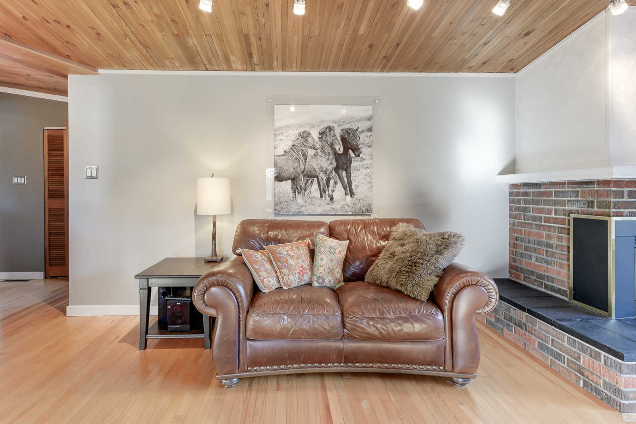 a living room filled with furniture and a flat screen tv