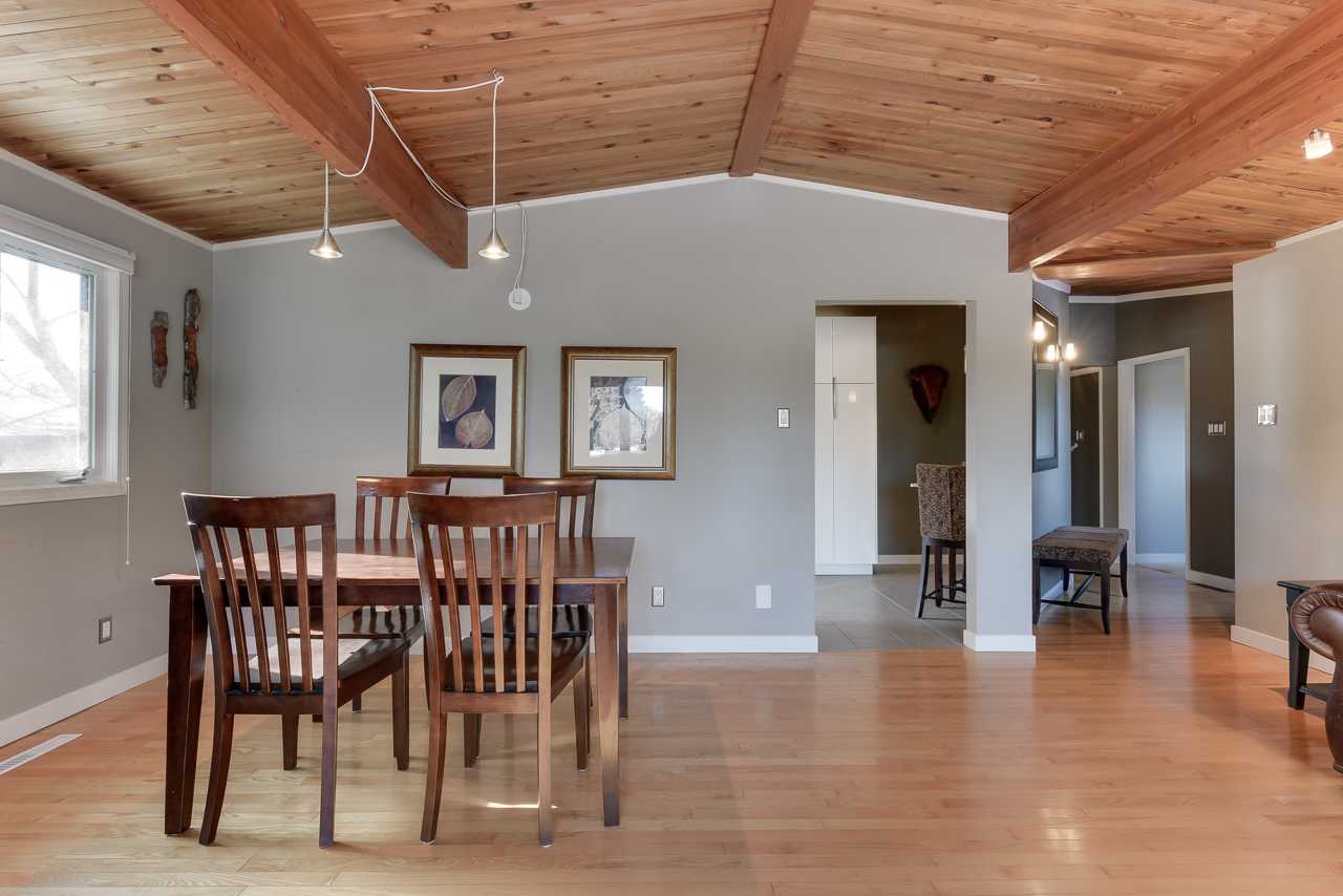 a dining room table in front of a hard wood floor