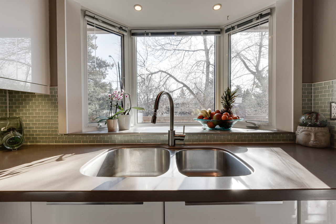 a kitchen with a sink and a window