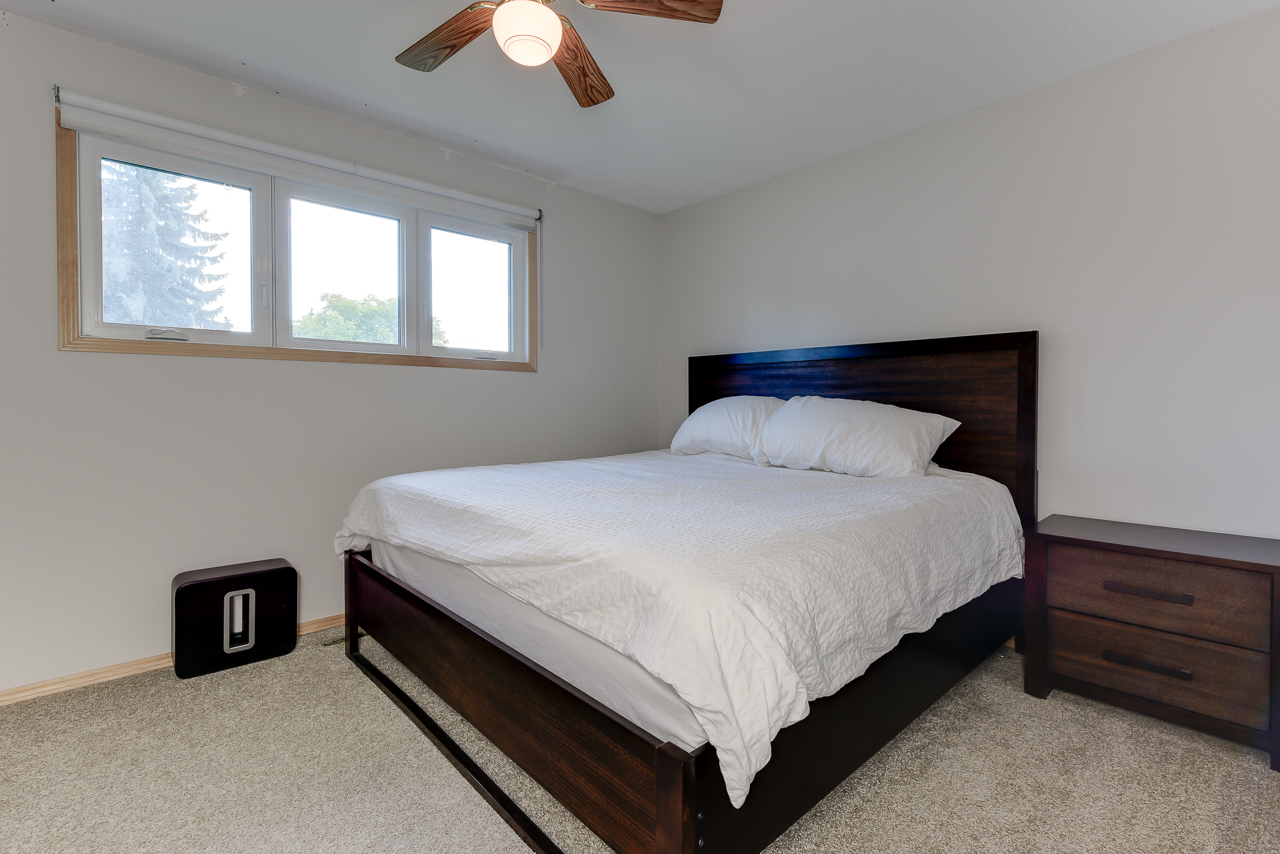 a bedroom with a bed in a hotel room