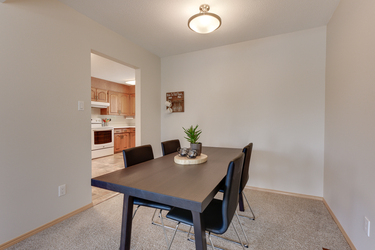 a kitchen with a table in a living room