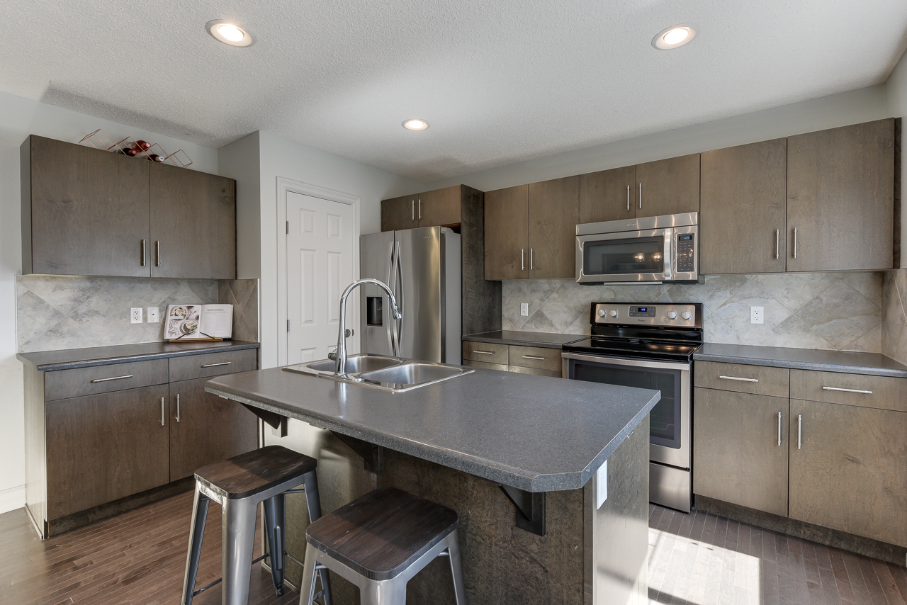 a modern kitchen with stainless steel appliances