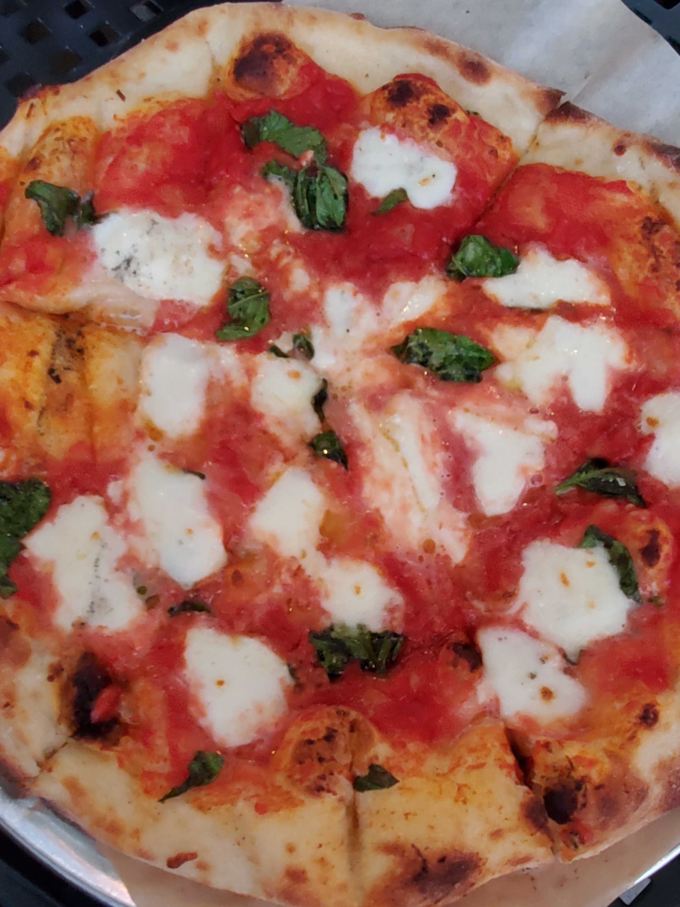 Pizza with marinara sauce and mozzarella cheese
