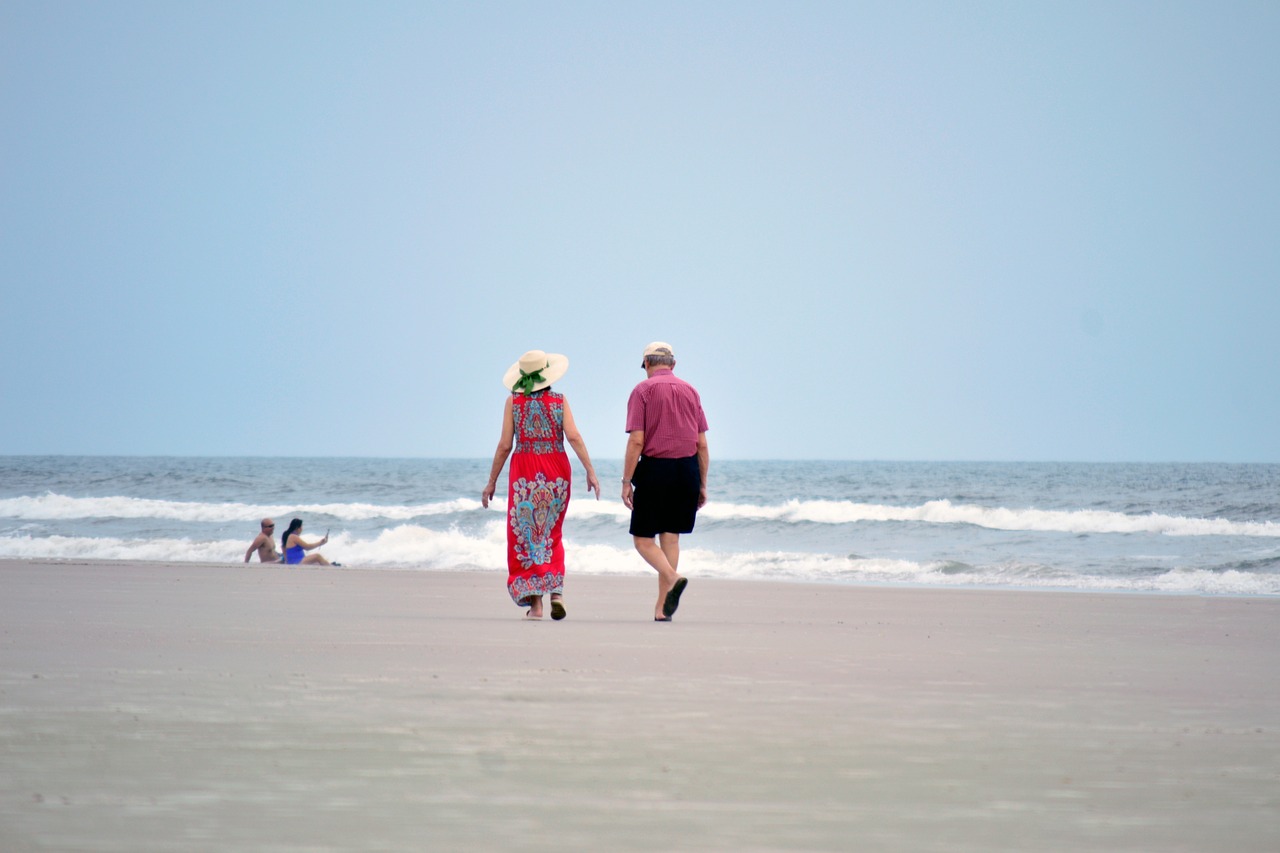 Couple walking together on the beach