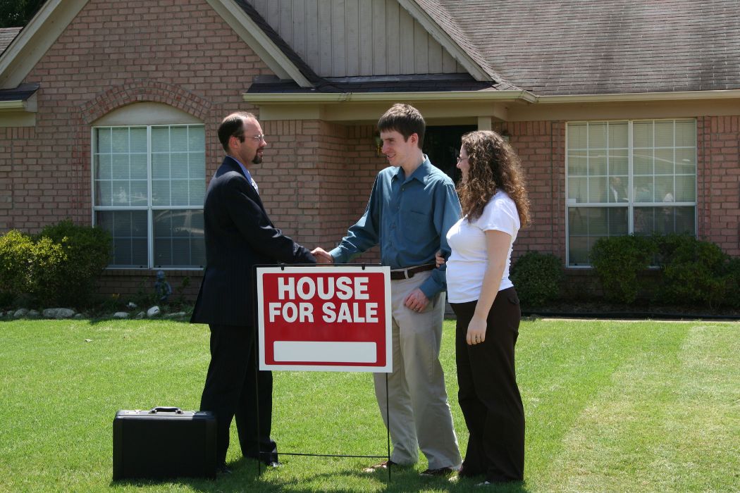 Image of a couple buying a house