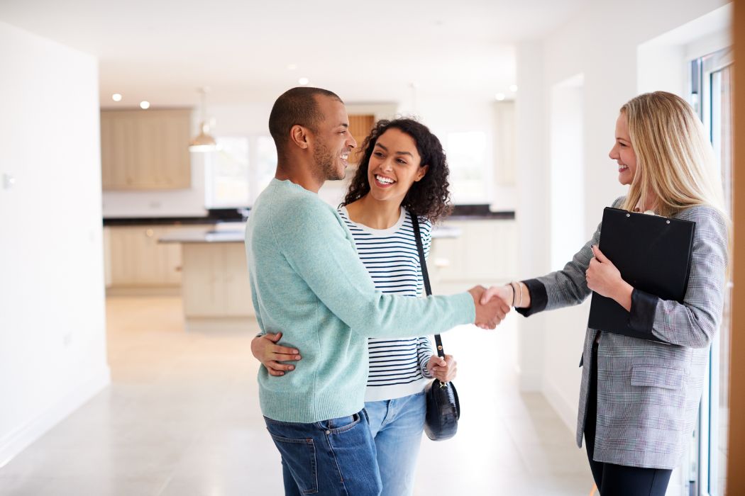 image of a couple buying a house