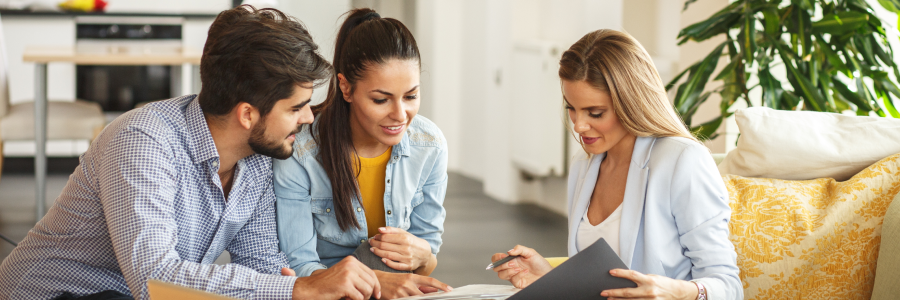 couple speaking with real estate agent