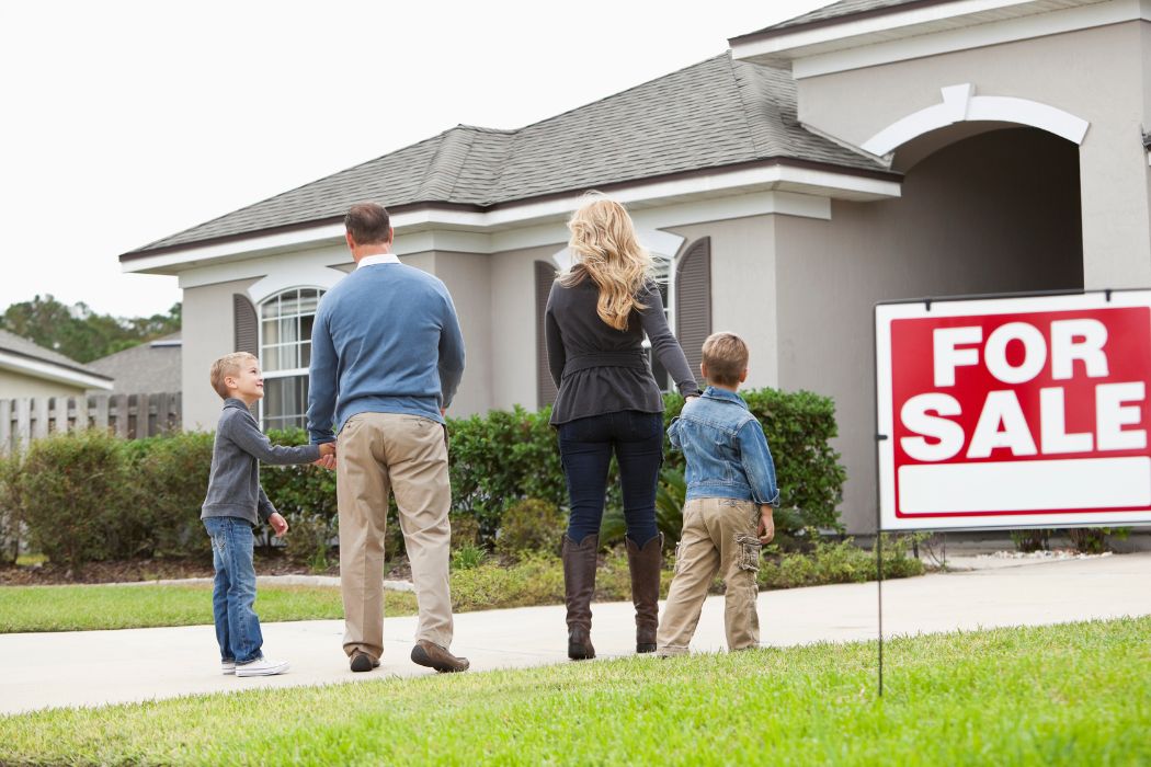 image of a family buying a property that had an increase home value