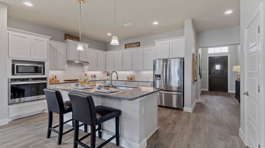 Single Story Home for Sale in Avalon at Argyle features granite kitchen island