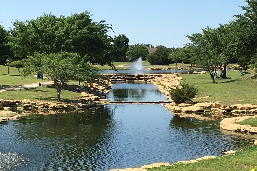 Trails around Pond in Villages of Woodland Springs Neighborhood