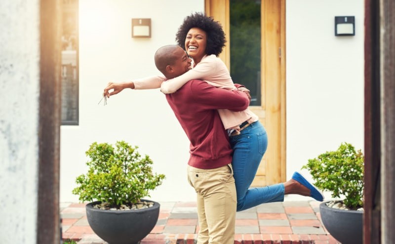 happy couple purchasing home
