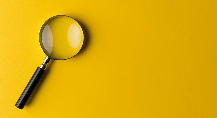 magnifying glass on yellow background