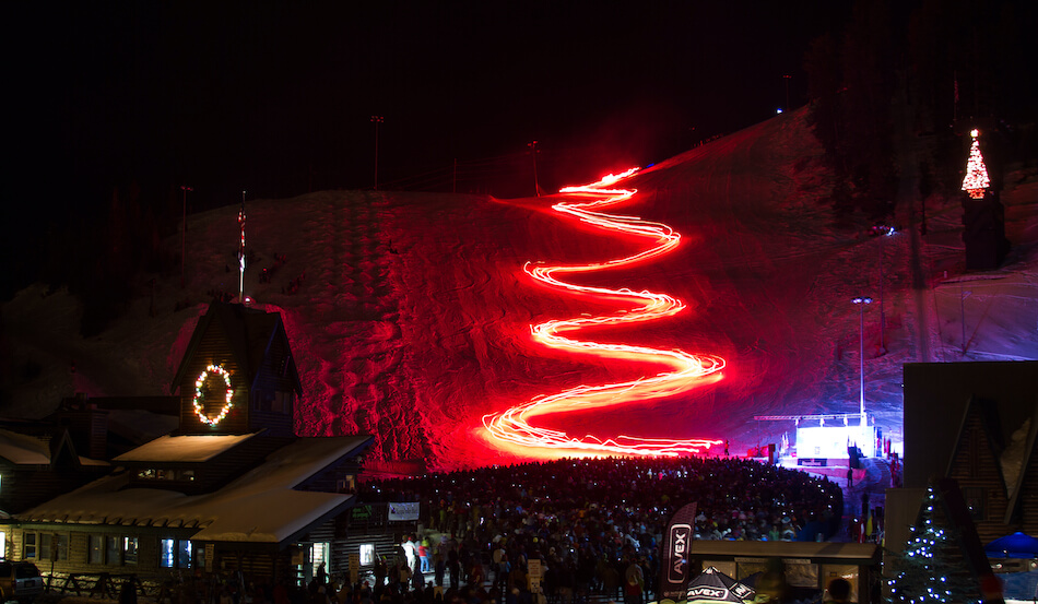 Ski Slope at Night with Neon Lights at the Winter Carnival in Steamboat Springs