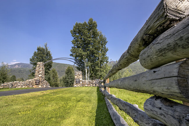 Elk Horn Entrance with Log Fencing and Rock Gate