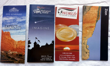 4 Southern Utah Attractions- Pamphlets of Tuacahn Schedule, Utah Shakespearean Festival, Huntsman World Senior Games, & Zion National Park