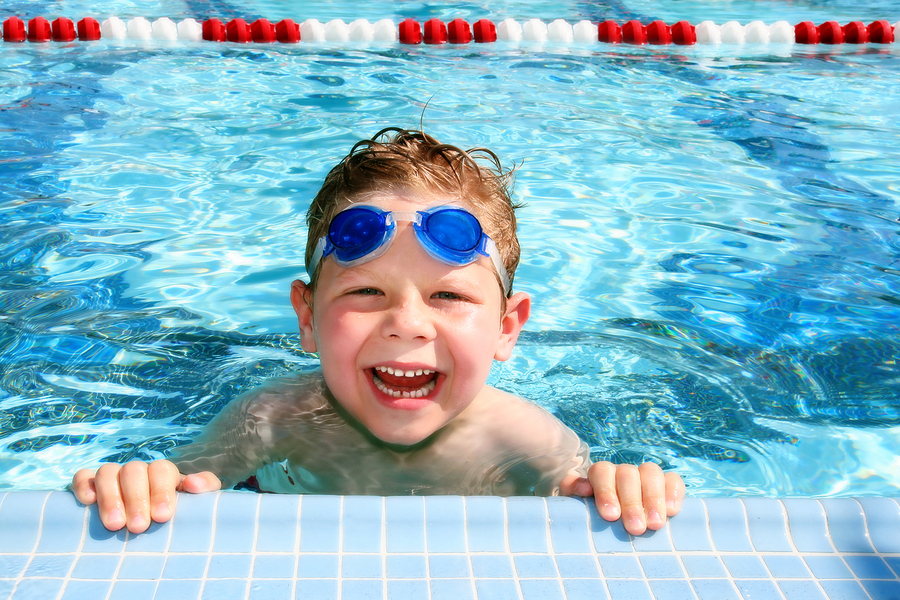 kid floating in pool