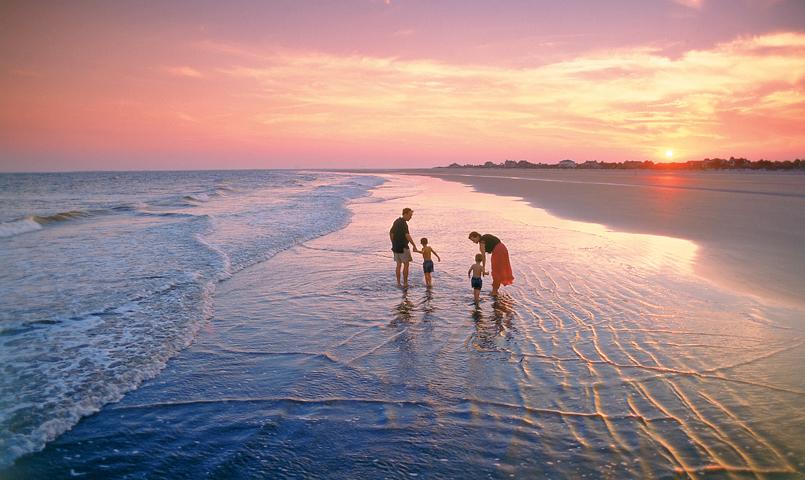 Family walking on Seabrook Island Beach at Sunset