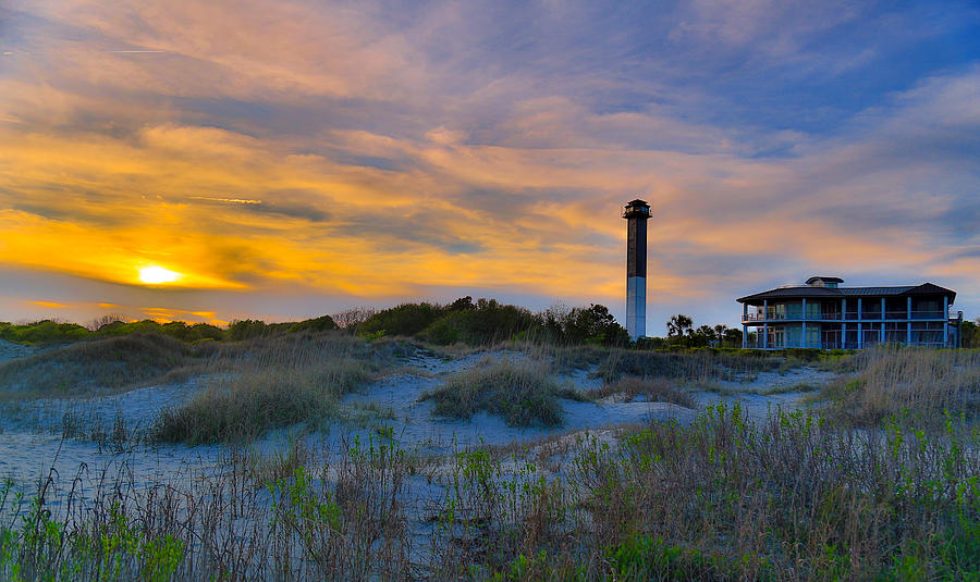 Sullivans Island Beach with Sullivans Island Light House in the background at sunset