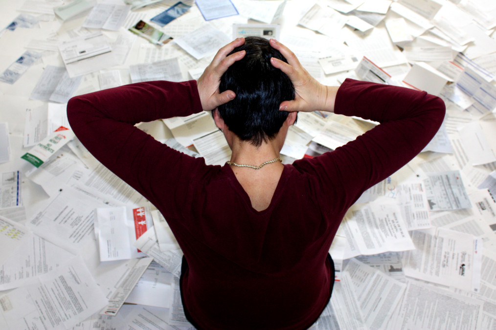 Woman frustrated by the amount of paperwork she has to do when For Sale By Owner