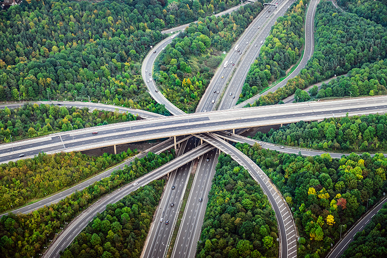 Highways intersecting in wooded area