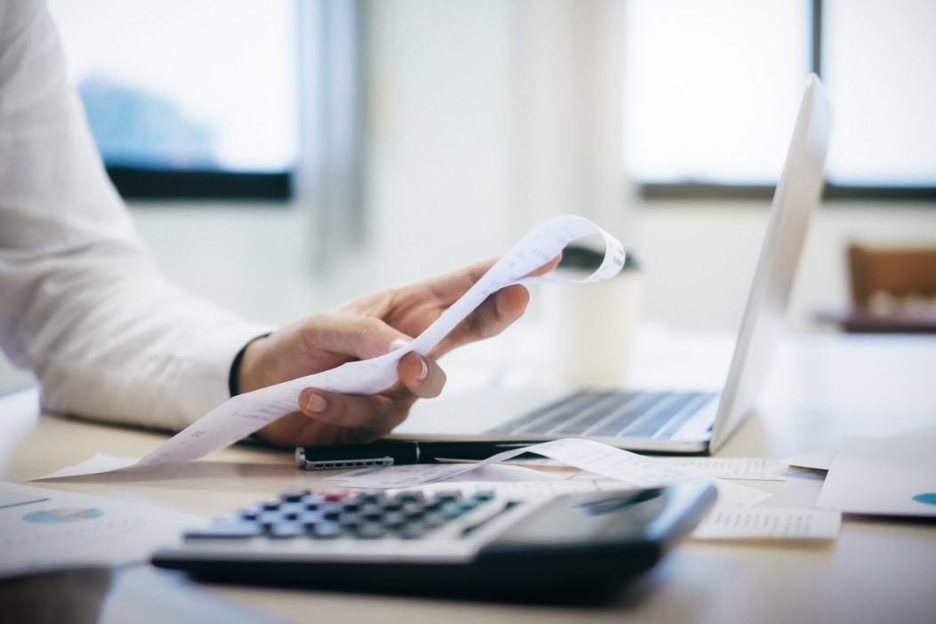 charleston home buyer looking at receipts and calculating budget