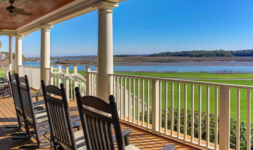Home on the Kiawah River Estate Golf Course, with rocking chairs on porch 