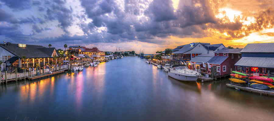 Shem creek, Mount Pleasant at Sunset with Restaurants and Boats 