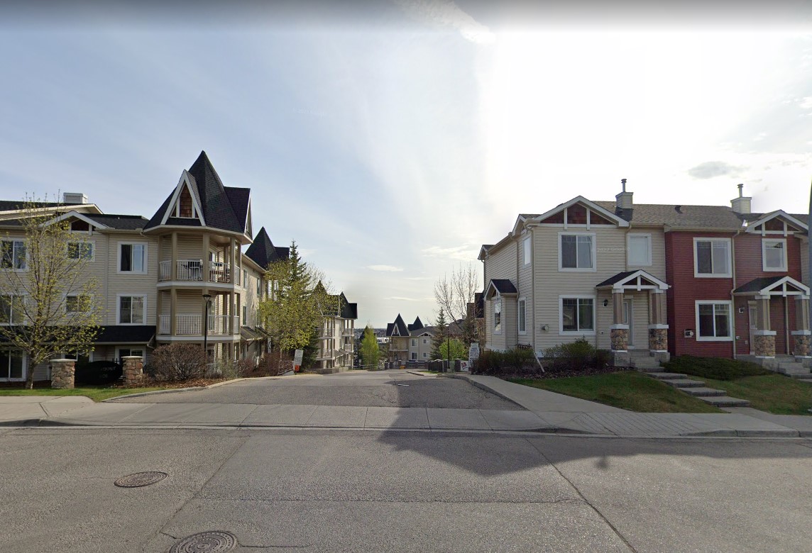 Entrance to condo complex Panamount Place, view of apartments and townhomes