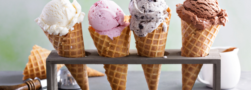 4 Waffle cones with colorful ice cream 