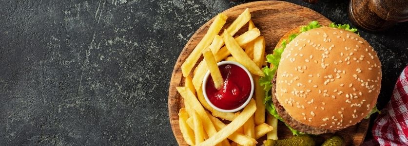 Burger with fries and ketchup 