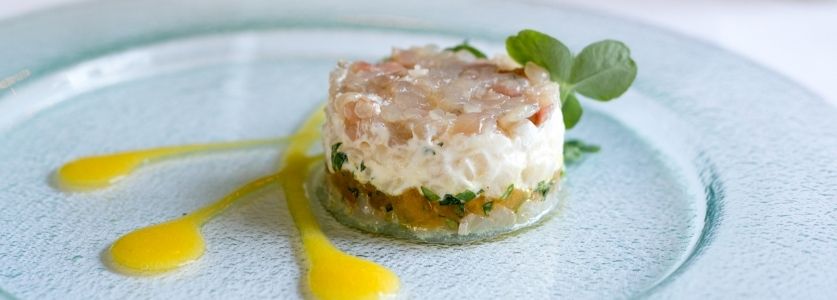 Tuna tar tar on a clear plate 