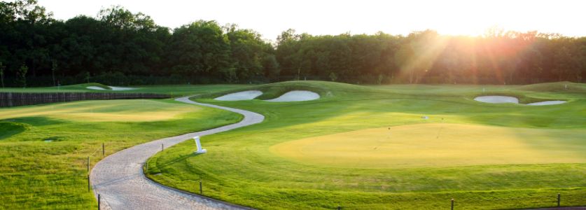 tree lined golf course in late afternoon