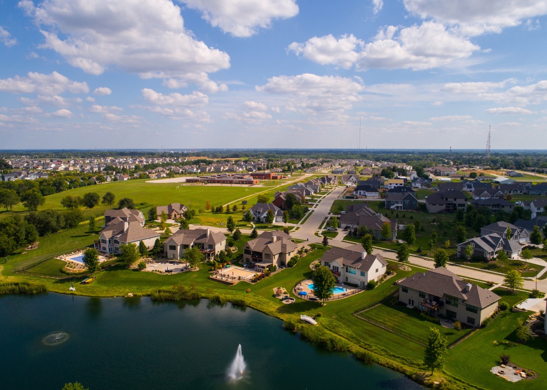 Aerial view of waterfront single-family homes in Bettendorf. 