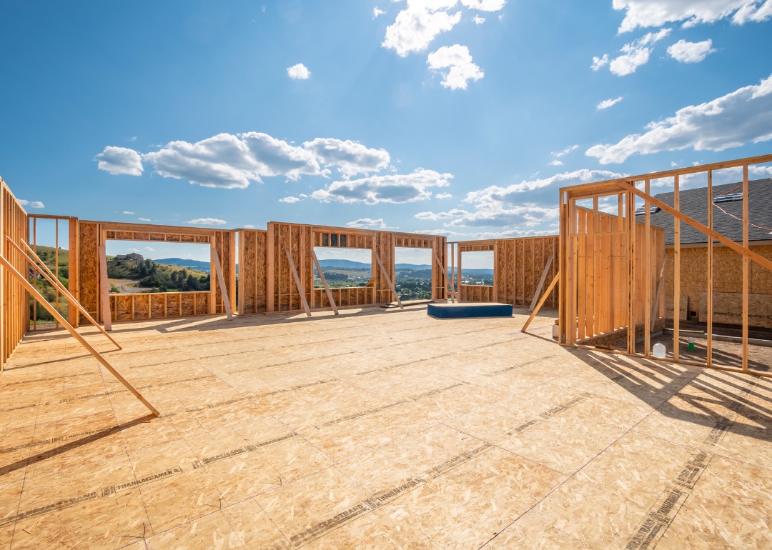 A new construction home being framed on a hillside with a view overlooking Spokane Valley.
