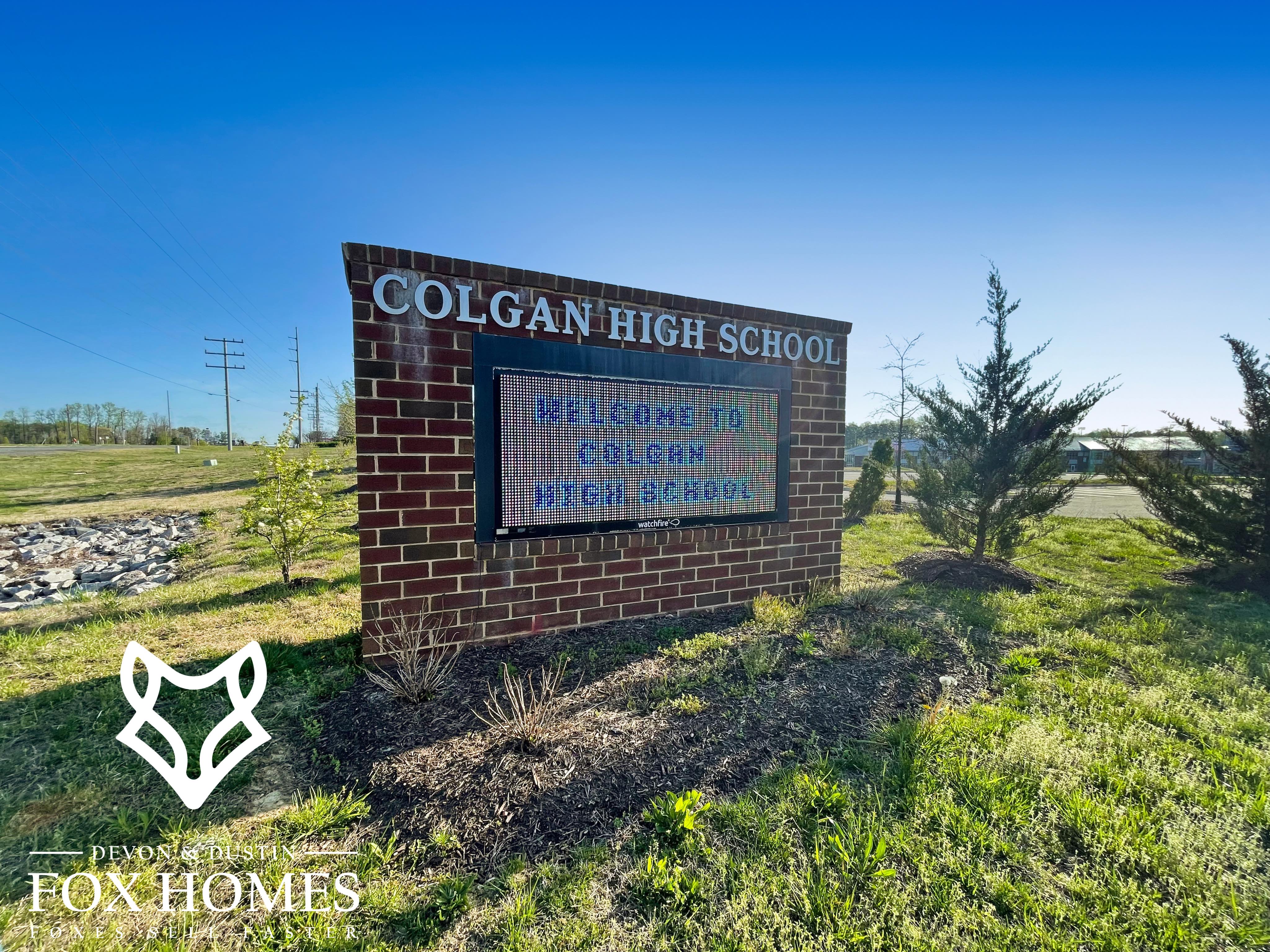 Homes-For-Sale-In-Colgan-High-School-District-Devon-and-Dustin-Fox-Fox-Homes-Team-Scool-Signage