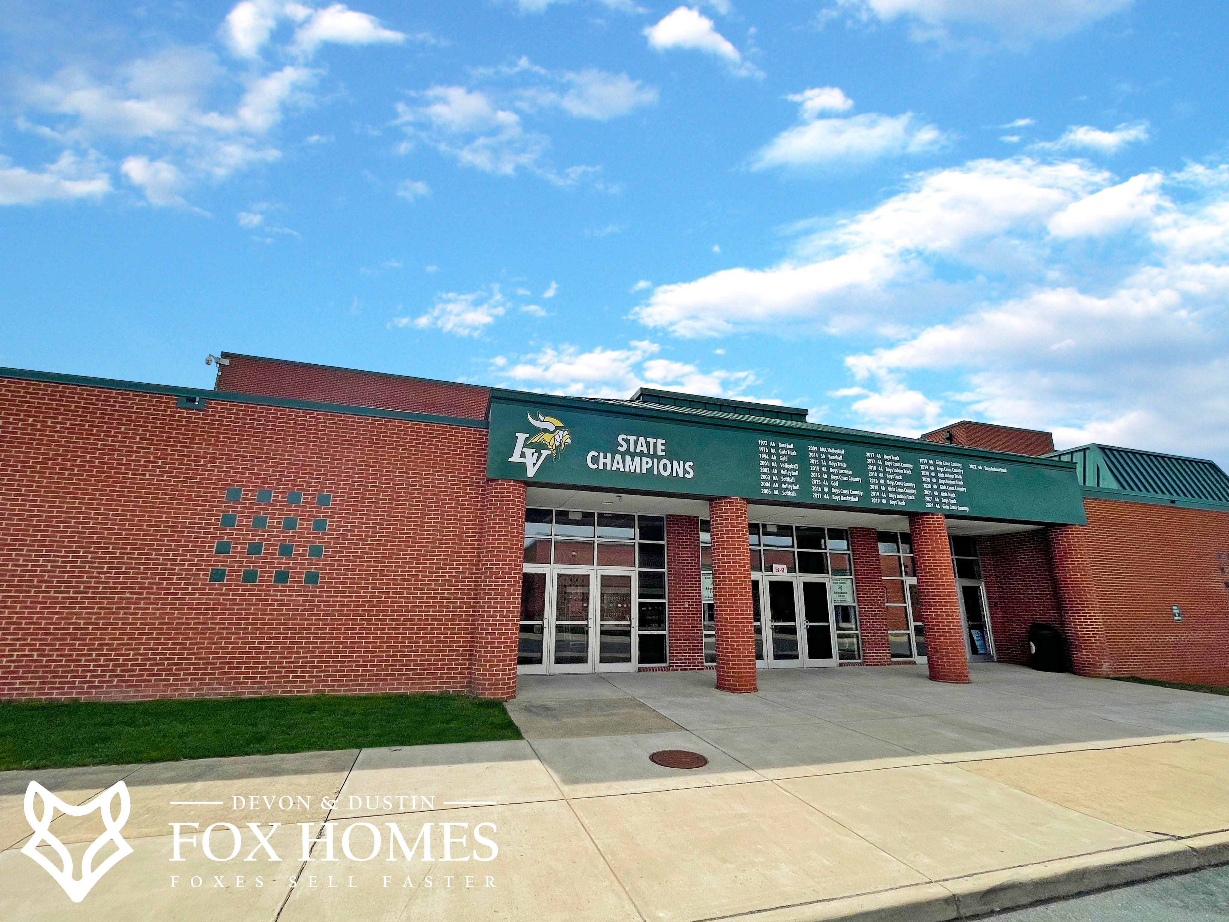 Homes-For-Sale-In-LoudounValley-High-School-District-Devon-and-Dustin-Fox-Fox-Homes-Team-State-Champions-Building