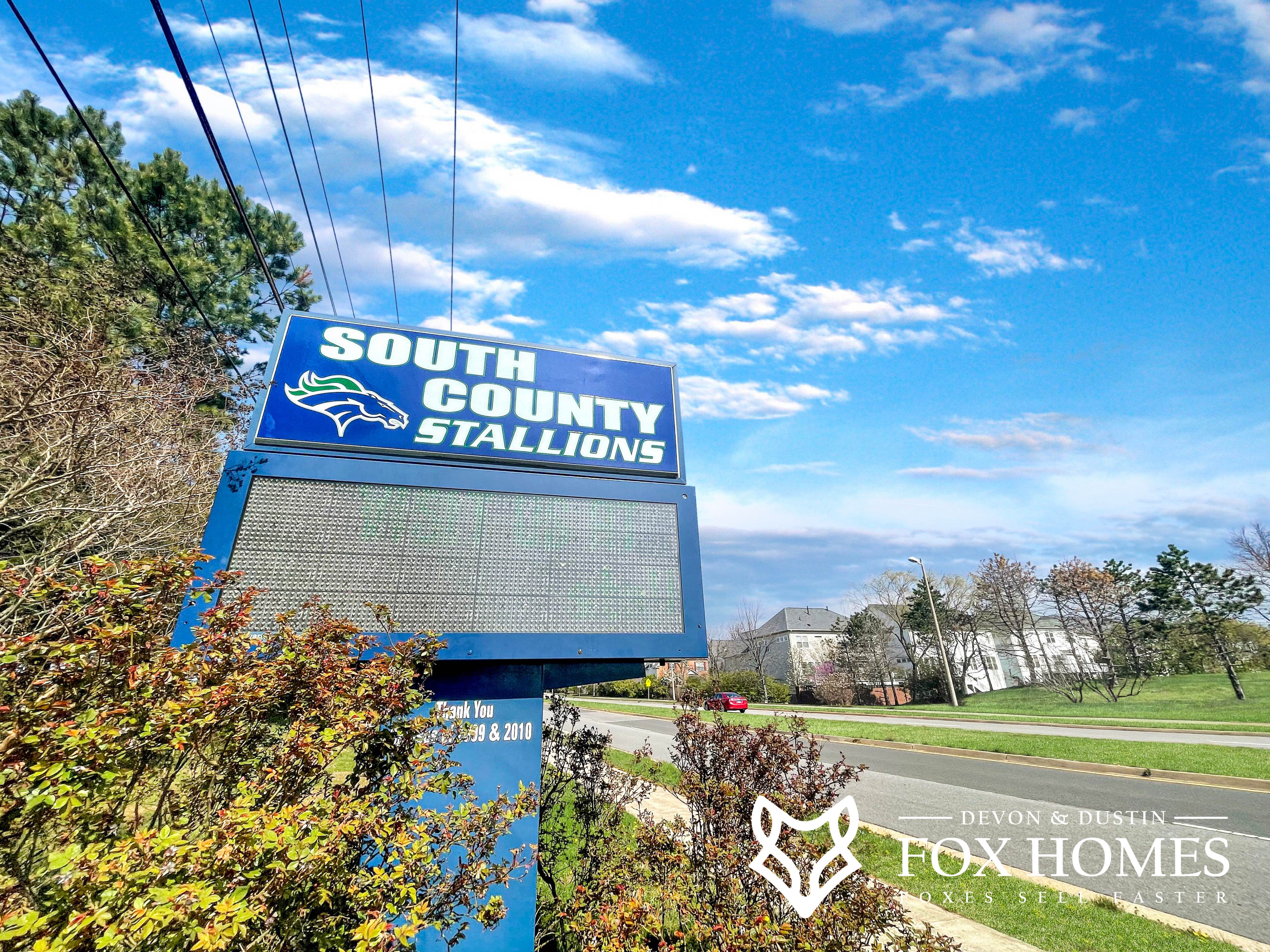 Homes-For-Sale-In-South-County-School-District-Devon-and-Dustin-Fox-Fox-Homes-Team-Entrance-Sign.