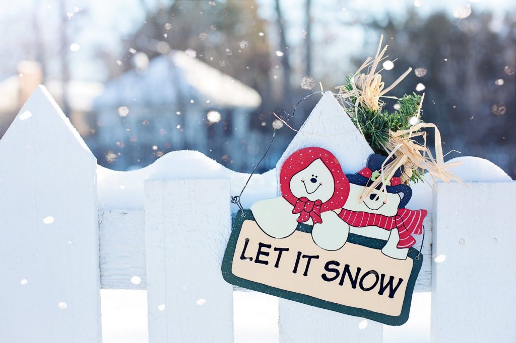 Let It Snow Sign on Picket Fence