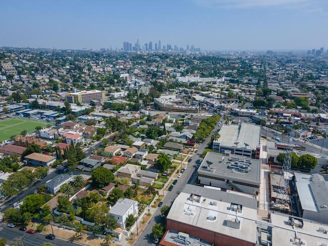 Aerial photo of Los Angeles neighborhood with the skyline in the background