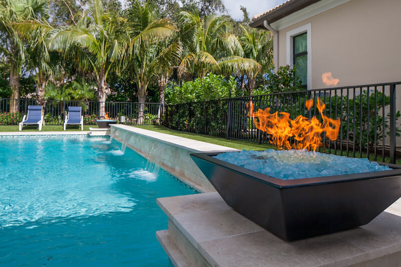 Water and Fire Features Make a Pool Look Luxurious