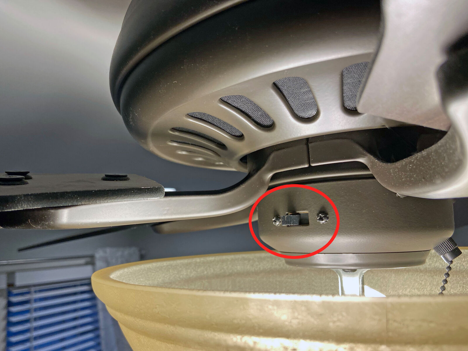 Ceiling fan with a reverse switch