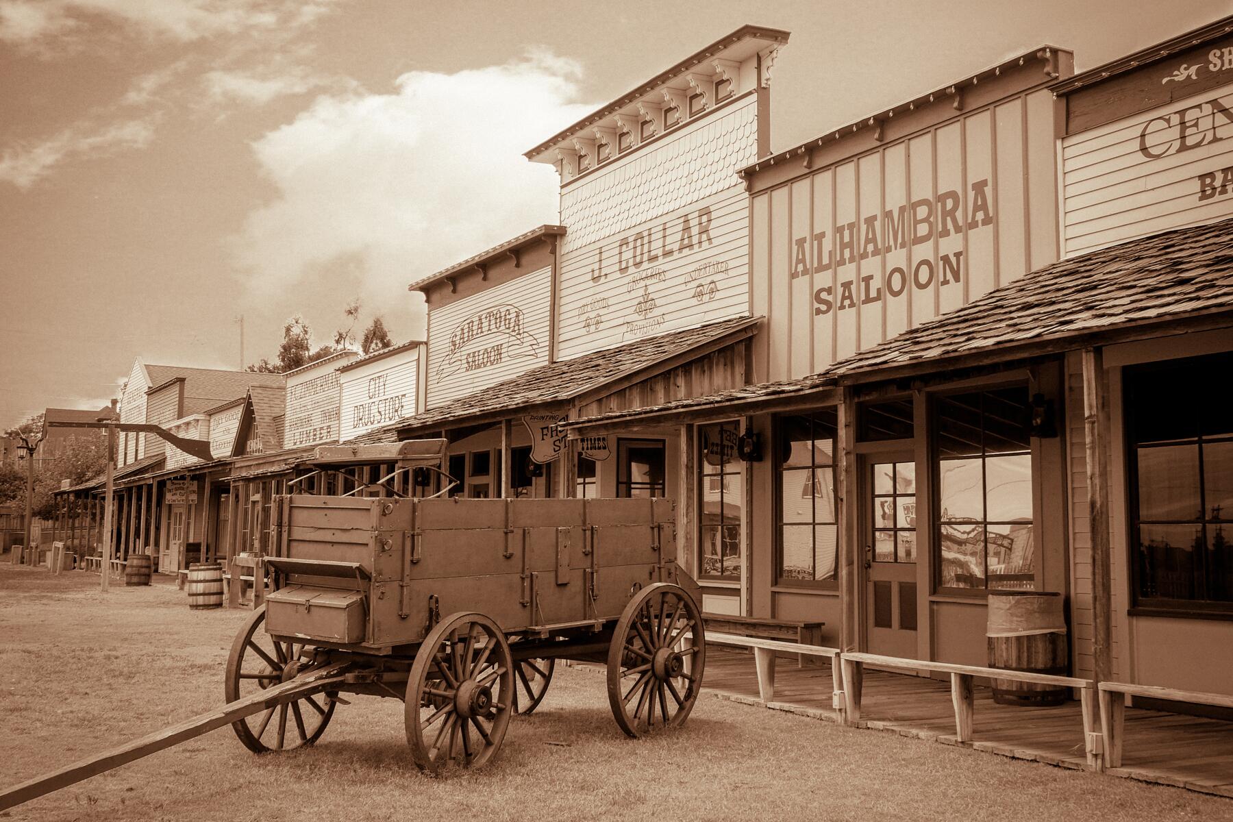 A wagon sits outside a saloon
