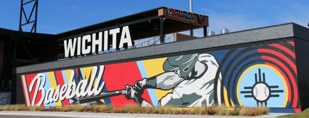 an image of a mural of someone swinging a bat on the exterior wall of riverfront stadium